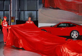 6th Feb 2002:  Michael Schumacher (L) of Germany and Rubens Barrichello of Brazil and Ferrari remove the covers of the new Ferrari car during the press conference held to launch the new Ferrari F2002 Formula One car in Maranello, Italy.  \ Mandatory Credit: Mark Thompson /Allsport