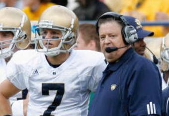 ANN ARBOR, MI - SEPTEMBER 15:  Jimmy Clausen #7 stands next to head coach Charlie Weis of the Notre Dame Fighting Irish during the game against the Michigan Wolverines on September 15, 2007 at Michigan Stadium in Ann Arbor, Michigan. Michigan won 38-0. (Photo by Gregory Shamus/Getty Images)  