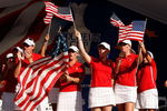 SUGAR GROVE, IL - AUGUST 23:  Members of the U.S. Team celebrate during the closing ceremonies for the 2009 Solheim Cup at Rich Harvest Farms on August 23, 2009 in Sugar Grove, Illinois.  (Photo by Chris Graythen/Getty Images)
