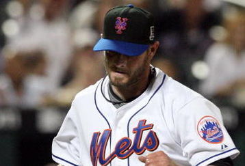 NEW YORK - AUGUST 20:  Billy Wagner #13 of the New York Mets walks back to the dugout after the final out of the eighth inning against the Atlanta Braves on August 20, 2009 at Citi Field in the Flushing neighborhood of the Queens borough of New York City.  (Photo by Jim McIsaac/Getty Images)