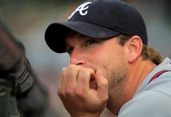 DENVER - JULY 09:  Starting pitcher Derek Lowe #2 of the Atlanta Braves looks on from the dugout on the eve of his start against the Colorado Rockies during MLB action at Coors Field on July 9, 2009 in Denver, Colorado. The Rockies defeated the Braves 7-6.  (Photo by Doug Pensinger/Getty Images)