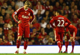 LIVERPOOL, ENGLAND - AUGUST 24:  Fernando Torres of Liverpool shows his dejection during the Barclays Premier League match between Liverpool and Aston Villa at Anfield on August 24, 2009 in Liverpool, England. (Photo by Clive Brunskill/Getty Images)