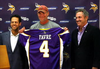 EDEN PRAIRIE, MN - AUGUST 18: Brett Favre (C), Mark Wilf (L) and Zygi Wilf show the media Favre's Minnesota Vikings jersey on August 18, 2009 at Winter Park in Eden Prairie, Minnesota. (Photo by Scott A. Schneider/Getty Images)