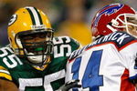 GREEN BAY, WI - AUGUST 22: Linebacker Desmond Biship #55 of the Green Bay Packers grabs quarterback Ryan Fitzpatrick #14 of the Buffalo Bills at Lambeau Field on August 22, 2009 in Green Bay. Wisconsin.  The Packers defeated the Bills 31-21. (Photo by Scott Boehm/Getty Images)