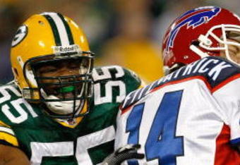 GREEN BAY, WI - AUGUST 22: Linebacker Desmond Biship #55 of the Green Bay Packers grabs quarterback Ryan Fitzpatrick #14 of the Buffalo Bills at Lambeau Field on August 22, 2009 in Green Bay. Wisconsin.  The Packers defeated the Bills 31-21. (Photo by Scott Boehm/Getty Images)