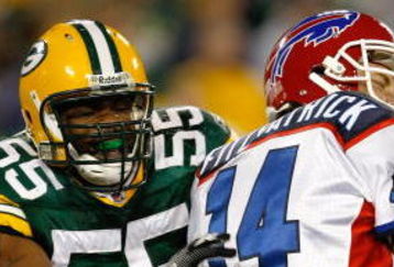 GREEN BAY, WI - AUGUST 22: Linebacker Desmond Biship #55 of the Green Bay Packers grabs quarterback Ryan Fitzpatrick #14 of the Buffalo Bills at Lambeau Field on August 22, 2009 in Green Bay. Wisconsin.  The Packers defeated the Bills 31-21. (Photo by Scott Boehm/Getty Images)