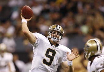 NEW ORLEANS - AUGUST 14:  Quarterback Drew Brees #9 of the New Orleans Saints throws a touchdown pass to tight end Jeremy Shockey (not pictured) during a preseason game against the Cincinnati Bengals on August 14, 2009 at the Superdome in New Orleans, Louisiana. (Photo by Chris Graythen/Getty Images)