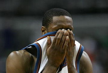 WASHINGTON  - APRIL 28:  Gilbert Arenas #00 of the Washington Wizards reacts during the second half of game three of the Eastern Conference Quarterfinals against the Cleveland Cavaliers during the 2006 NBA Playoffs at the Verizon Center on April 28, 2006 in Washington, DC. NOTE TO USER: User expressly acknowledges and agrees that, by downloading and/or using this Photograph, user is consenting to the terms and conditions of the Getty Images License Agreement.  (Photo by Jamie Squire/Getty Images)