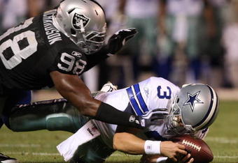 OAKLAND, CA - AUGUST 13: Defensive end Jay Richardson #98 of the Oakland Raiders sacks quarterback Jon Kitna #3 of the Dallas Cowboys after a bad snap during the preseason game at Oakland-Alameda County Coliseum on August 13, 2009 in Oakland, California. (Photo by Jed Jacobsohn/Getty Images)