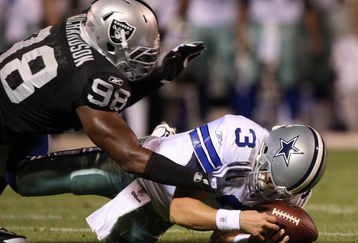 OAKLAND, CA - AUGUST 13: Defensive end Jay Richardson #98 of the Oakland Raiders sacks quarterback Jon Kitna #3 of the Dallas Cowboys after a bad snap during the preseason game at Oakland-Alameda County Coliseum on August 13, 2009 in Oakland, California. (Photo by Jed Jacobsohn/Getty Images)