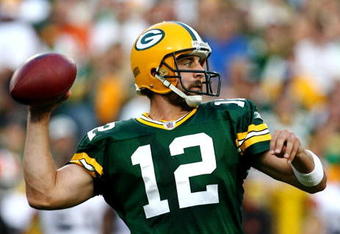 GREEN BAY, WI - AUGUST 15:  Quarterback Aaron Rodgers #12 of the Green Bay Packers passes the ball in the first quarter against the Cleveland Browns during the preseason game at Lambeau Field on August 15, 2009 in Green Bay, Wisconsin. (Photo by Jonathan Daniel/Getty Images)