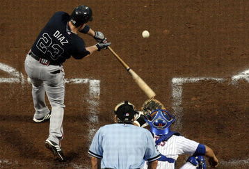 NEW YORK - AUGUST 19:  Matt Diaz #23 of the Atlanta Braves connects for a second inning two run single against the New York Mets on August 19, 2009 at Citi Field in the Flushing neighborhood of the Queens borough of New York City.  (Photo by Jim McIsaac/Getty Images)