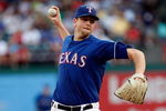 ARLINGTON, TX - JULY 29:  Pitcher Scott Feldman #39 of the Texas Rangers throws against the Detroit Tigers on July 29, 2009 at Rangers Ballpark in Arlington, Texas.  (Photo by Ronald Martinez/Getty Images)