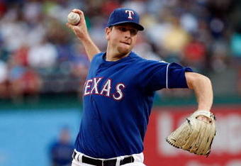 ARLINGTON, TX - JULY 29:  Pitcher Scott Feldman #39 of the Texas Rangers throws against the Detroit Tigers on July 29, 2009 at Rangers Ballpark in Arlington, Texas.  (Photo by Ronald Martinez/Getty Images)