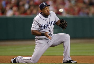 ANAHEIM, CA - AUGUST 12: Adrian Beltre #29 of the Seattle Mariners bobbles the ball on a grounder against the Los Angeles Angels of Anaheim at Angel Stadium on August 12, 2008 in Anaheim, California. The Angels defeated the Mariners 7-3. (Photo by Christian Petersen/Getty Images)