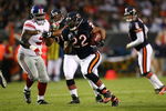 CHICAGO - AUGUST 22: Matt Forte #22 of the Chicago Bears runs for a 32-yard touchdown in the first quarter against the New York Giants during their preseason NFL game at Soldier Field on August 22, 2009 in Chicago, Illinois.  (Photo by Jonathan Daniel/Getty Images)