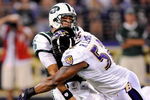BALTIMORE - AUGUST 24:  Mark Sanchez #6 of the New York Jets is hit by Ray Lewis #52 of the Baltimore Ravens in a preseason game at M&T Bank Stadium on August 24, 2009 in Baltimore, Maryland.  Sanchez's pass was intercepted and returned for a touchdown on the play.  (Photo by Greg Fiume/Getty Images)