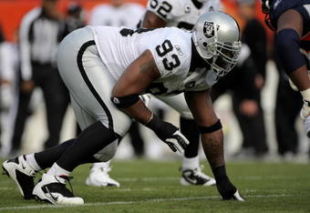 DENVER - NOVEMBER 23:  Defensive tackle Tommy Kelly #93 of the Oakland Raiders defends against the Denver Broncos during week 12 NFL action at Invesco Field at Mile High on November 23, 2008 in Denver, Colorado. The Raiders defeated the Broncos 31-10.  (Photo by Doug Pensinger/Getty Images)