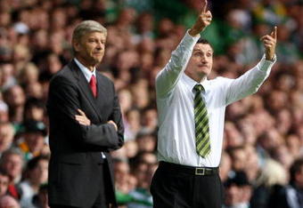GLASGOW, SCOTLAND - AUGUST 18:  Arsene Wenger manager of Arsenal with Tony Mowbury Manager of Celtic during a UEFA Champions League Qualifying match between Celtic and Arsenal at Celtic Park on August 18, 2009 in Glasgow, Scotland.  (Photo by Phil Cole/Getty Images)