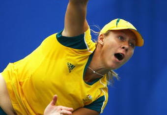 BEIJING - AUGUST 11: Alicia Molik of Australia serves against Maria Jose Martinez of Spain in the Women's Singles First Round match at the Olympic Green Tennis Center on Day 3 of the Beijing 2008 Olympic Games on August 11, 2008 in Beijing, China.  (Photo by Julian Finney/Getty Images)