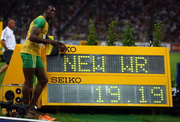 BERLIN - AUGUST 20:  Usain Bolt of Jamaica celebrates winning the gold medal in the men's 200 Metres Final during day six of the 12th IAAF World Athletics Championships at the Olympic Stadium on August 20, 2009 in Berlin, Germany.  Bolt set a new World Record of 19.19 seconds.  (Photo by Alexander Hassenstein/Getty Images)