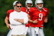 ALLEN PARK, MI - AUGUST 04:  Head coach Jim Schwartz looks on while Matthew Stafford #9 and Daunte Culpepper #11 warm up during training camp at the Detroit Lions Headquarters and Training Facility on August 4, 2009 in Allen Park, Michigan.  (Photo by Gregory Shamus/Getty Images)