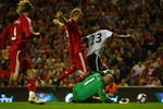 LIVERPOOL, ENGLAND - AUGUST 24:  Brad Friedel of Aston Villa dives to make a save at the feet of Dirk Kuyt of Liverpool during the Barclays Premier League match between Liverpool and Aston Villa at Anfield on August 24, 2009 in Liverpool, England.  (Photo by Clive Brunskill/Getty Images)