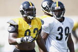 LATROBE, PA - AUGUST 06:  James Harrison #92 of the Pittsburgh Steelers talks with Willie Parker #39 during training camp at St. Vincent College on August 6, 2009 in Latrobe, Pennsylvania.  (Photo by Gregory Shamus/Getty Images)