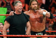 LAS VEGAS - AUGUST 24: World Wrestling Entertainment Inc. Chairman Vince McMahon (L) and wrestler Triple H appear in the ring during the WWE Monday Night Raw show at the Thomas & Mack Center August 24, 2009 in Las Vegas, Nevada. (Photo by Ethan Miller/Getty Images)