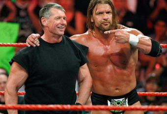 LAS VEGAS - AUGUST 24:  World Wrestling Entertainment Inc. Chairman Vince McMahon (L) and wrestler Triple H appear in the ring during the WWE Monday Night Raw show at the Thomas & Mack Center August 24, 2009 in Las Vegas, Nevada.  (Photo by Ethan Miller/Getty Images)