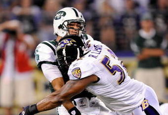 BALTIMORE - AUGUST 24:  Mark Sanchez #6 of the New York Jets is hit by Ray Lewis #52 of the Baltimore Ravens in a preseason game at M&T Bank Stadium on August 24, 2009 in Baltimore, Maryland.  Sanchez's pass was intercepted and returned for a touchdown on the play.  (Photo by Greg Fiume/Getty Images)
