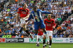 WIGAN, ENGLAND - AUGUST 22:  Wayne Rooney (L) of Manchester United scores the opening goal during the Barclays Premier League match between Wigan Athletic and Manchester United at the DW Stadium on August 22, 2009 in Wigan, England.  (Photo by Alex Livesey/Getty Images)