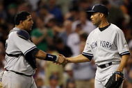 BOSTON - AUGUST 23: Mariano Rivera #42 and Jose Molina #26 of the New York Yankees celebrate the win over the Boston Red Sox on August 23, 2009 at Fenway Park in Boston, Massachusetts. The Yankees defeated the Red Sox 8-4. (Photo by Elsa/Getty Images)