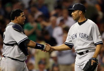 BOSTON - AUGUST 23: Mariano Rivera #42 and Jose Molina #26 of the New York Yankees celebrate the win over the Boston Red Sox on August 23, 2009 at Fenway Park in Boston, Massachusetts. The Yankees defeated the Red Sox 8-4.  (Photo by Elsa/Getty Images)