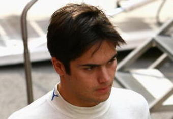 BARCELONA, SPAIN - FEBRUARY 27: Nelson Piquet Jr. of Brazil and Renault walks through the paddock during day three of Formula One Testing at the Circuit de Catalunya on February 27, 2008 in Barcelona, Spain.  (Photo by Ryan Pierse/Getty Images)