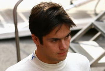 BARCELONA, SPAIN - FEBRUARY 27: Nelson Piquet Jr. of Brazil and Renault walks through the paddock during day three of Formula One Testing at the Circuit de Catalunya on February 27, 2008 in Barcelona, Spain.  (Photo by Ryan Pierse/Getty Images)