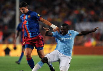 BARCELONA, SPAIN - AUGUST 19:  Zlatan Ibrahimovic (L) of Barcelona duels for the ball with Nedum Onuoha of Manchester City during the Joan Gamper Trophy match between Barcelona and Manchester City at the Camp Nou Stadium on August 19, 2009 in Barcelona, Spain. Manchester City won the match 1-0.  (Photo by Jasper Juinen/Getty Images)