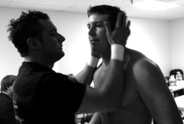 ELDON - JULY 8: Mike DiBiase speaks with his brother, Teddy Jr., before their first professional fight for the World League Wrestling on July 8, 2006 in Eldon, Missouri. They trained at the Harley Race Wrestling Academy. Harley Race's legendary wrestling career spanned nearly four decades. During that time Race won eight NWA World Championships, managed two wrestlers to the WCW World Championship and was involved in operating the NWA territories in Kansas City and St. Louis. Mike and Teddy DiBiase Jr. are the sons of world famous Ted DiBiase, better known as The Million Dollar Man in the wrestling world. (Photo by Ezra Shaw/Getty Images)