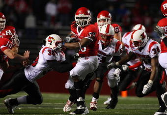 PISCATAWAY, NJ - DECEMBER 04:  Jourdan Brooks #39 of the Rutgers Scarlet Knights runs the ball against the Louisville Cardinals at Rutgers Stadium on December 4, 2008 in Piscataway, New Jersey.  (Photo by Jim McIsaac/Getty Images)