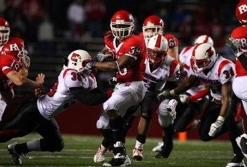 PISCATAWAY, NJ - DECEMBER 04:  Jourdan Brooks #39 of the Rutgers Scarlet Knights runs the ball against the Louisville Cardinals at Rutgers Stadium on December 4, 2008 in Piscataway, New Jersey.  (Photo by Jim McIsaac/Getty Images)