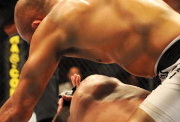 PHILADELPHIA - AUGUST 08:  (Top) Lightweight champion BJ Penn battles Kenny Florian during their lightweight championship title bout at UFC 101: Declaration at the Wachovia Center on August 8, 2009 in Philadelphia, Pennsylvania.  (Photo by Jon Kopaloff/Getty Images)