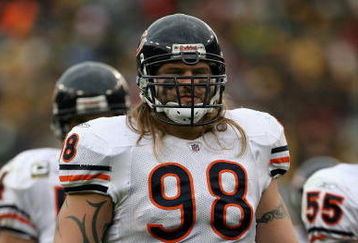 GREEN BAY, WI - NOVEMBER 16:  Defensive tackle Dusty Dvoracek #98 of the Chicago Bears awaits action at the line of scrimmage as he defends against the Green Bay Packers during NFL action at Lambeau Field on November 16, 2008 in Green Bay, Wisconsin. The Packers defeated the Bears 37-3.  (Photo by Doug Pensinger/Getty Images)
