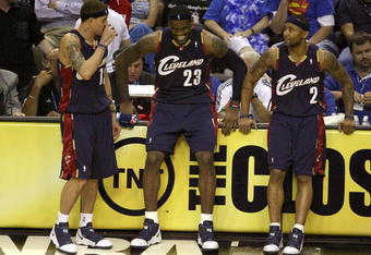ORLANDO, FL - MAY 30: Delonte West #13, LeBron James #23 and Mo Williams #2 of the Cleveland Cavaliers sit on the sidelines preparing to take the court against the Orlando Magic in Game Six of the Eastern Conference Finals during the 2009 Playoffs at Amway Arena on May 30, 2009 in Orlando, Florida. NOTE TO USER: User expressly acknowledges and agrees that, by downloading and or using this photograph, User is consenting to the terms and conditions of the Getty Images License Agreement  (Photo by Doug Benc/Getty Images)