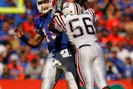 GAINESVILLE, FL - NOVEMBER 17:  Tim Tebow #15 of the Florida Gators throws a pass under pressure from Frantz Joseph #56 of the FAU Owls at Ben Hill Griffin Stadium on November 17, 2007 in Gainesville, Florida.  The Gators won the game 59-20.  (Photo by Sam Greenwood/Getty Images)