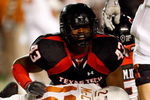 LUBBOCK, TX - NOVEMBER 01:  McKinner Dixon #43 of the Texas Tech Red Raiders tackles sacks quarterback Colt McCoy #12 of the Texas Longhorns during the first half of the game on November 1, 2008 at Jones Stadium in Lubbock, Texas.  (Photo by Jamie Squire/Getty Images)