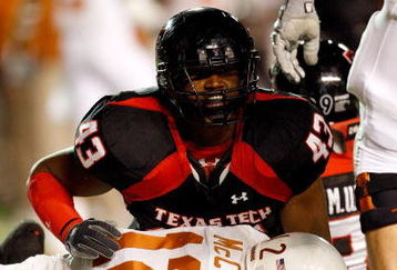 LUBBOCK, TX - NOVEMBER 01:  McKinner Dixon #43 of the Texas Tech Red Raiders tackles sacks quarterback Colt McCoy #12 of the Texas Longhorns during the first half of the game on November 1, 2008 at Jones Stadium in Lubbock, Texas.  (Photo by Jamie Squire/Getty Images)
