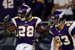 MINNEAPOLIS - JANUARY 4:  Adrian Peterson #28 of the Minnesota Vikings celebrates his touchdown with teammate Jeff Dugan #83 in the first half against the Philadelphia Eagles during the NFC Wild Card playoff game on January 4, 2009 at the Hubert H. Humphrey Metrodome in Minneapolis, Minnesota. (Photo by Elsa/Getty Images)
