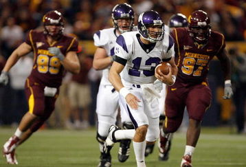 MINNEAPOLIS - NOVEMBER 01:  Mike Kafka #13 of the Northwestern Wildcats rushes against the Minnesota Golden Gophers during the first quarter at the Hubert H.Humphrey Metrodome on November 1, 2008 in Minneapolis, Minnesota  (Photo by Harry How/Getty Images)