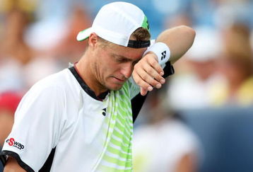 CINCINNATI - AUGUST 21:  Lleyton Hewitt of Australia wipes sweat from his face against Roger Federer of Switzerland during day five of the Western & Southern Financial Group Masters on August 21, 2009 at the Lindner Family Tennis Center in Cincinnati, Ohio.  (Photo by Nick Laham/Getty Images)