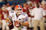 MIAMI - JANUARY 08:  Quarterback Tim Tebow #15 of the Florida Gators runs to pass the ball against the Oklahoma Sooners during the FedEx BCS National Championship Game at Dolphin Stadium on January 8, 2009 in Miami, Florida.  (Photo by Eliot J. Schechter/Getty Images